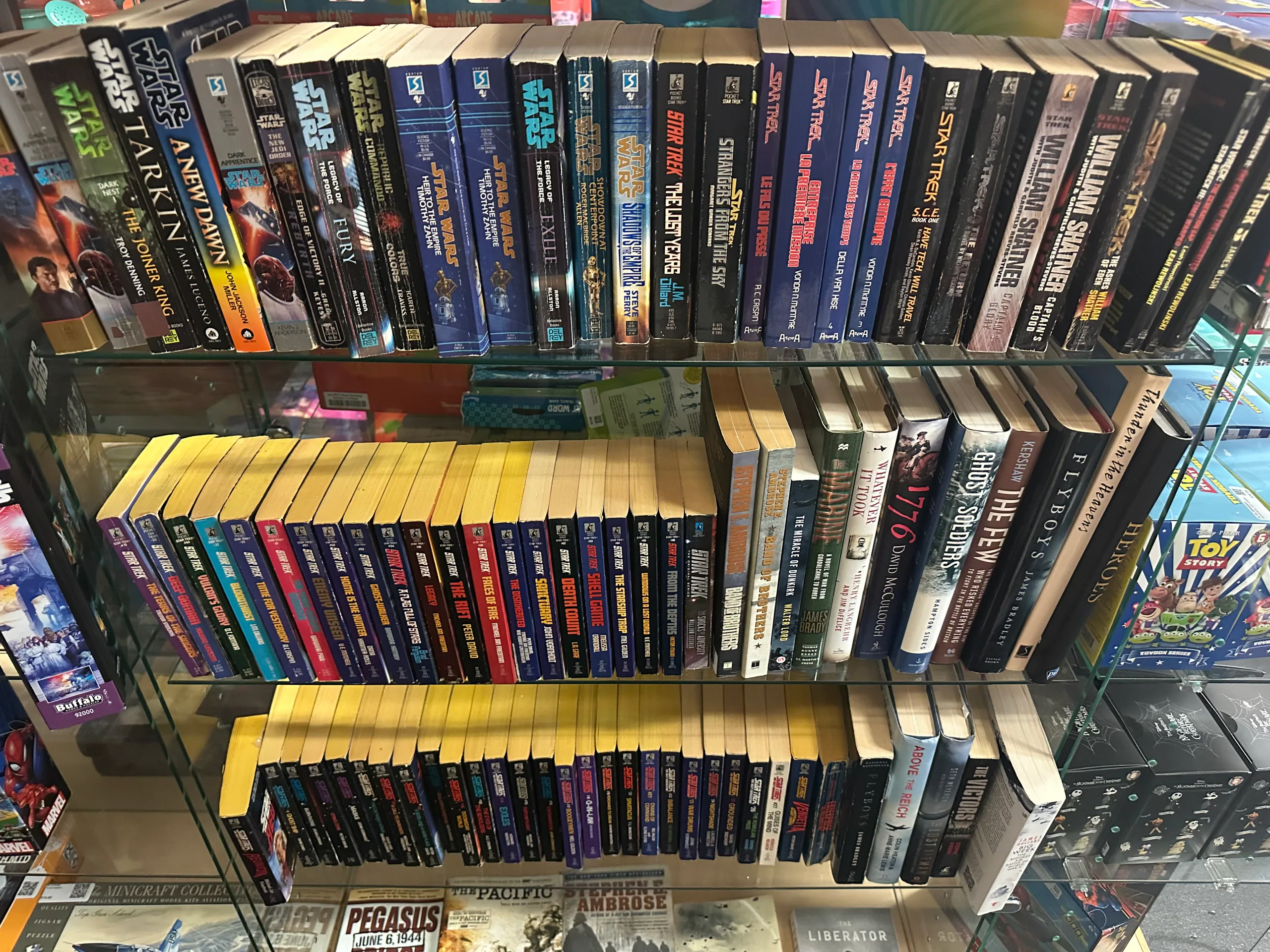 Shelves filled with Star Wars and Star Trek books