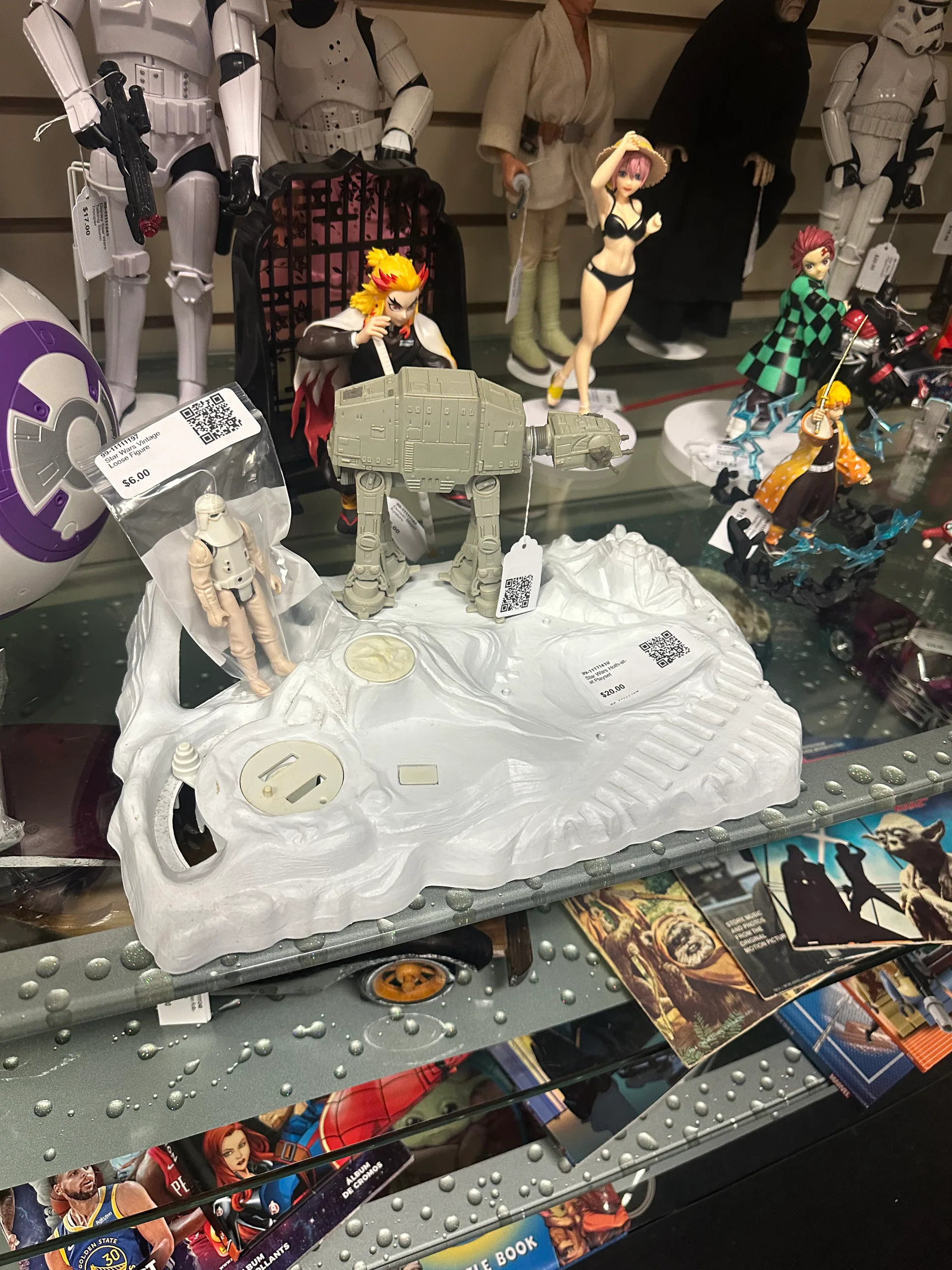 Star Wars Hoth playset surrounded by action figures in a display case
