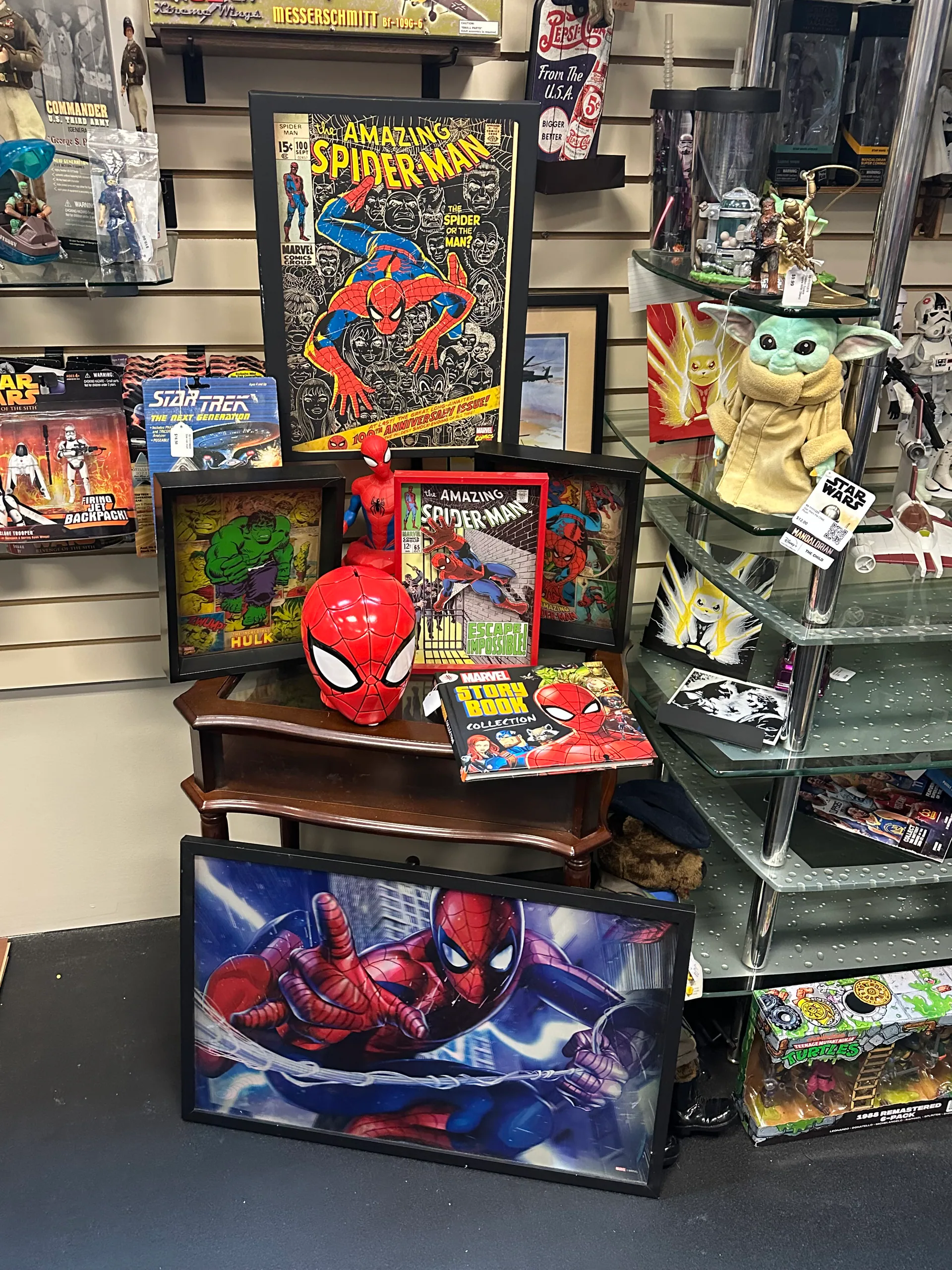 Spider-Man artwork and collectibles arranged inside the booth